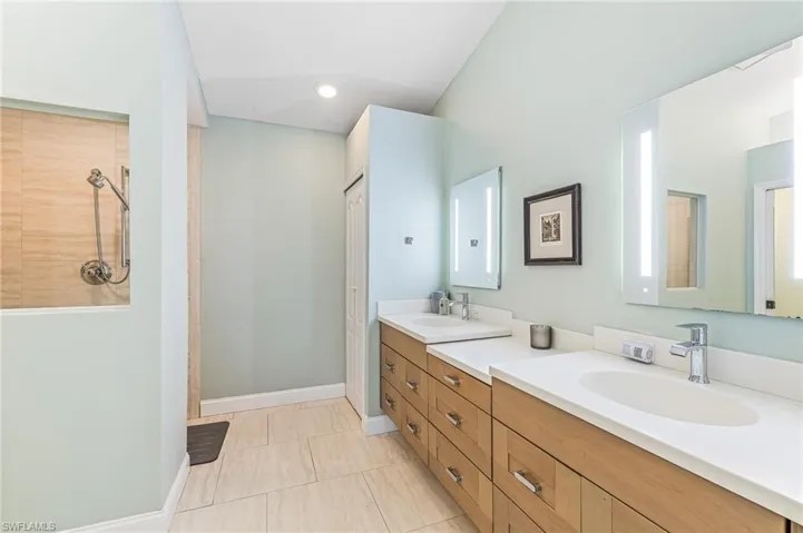 Primary walk in shower dual sink private WC with bidet