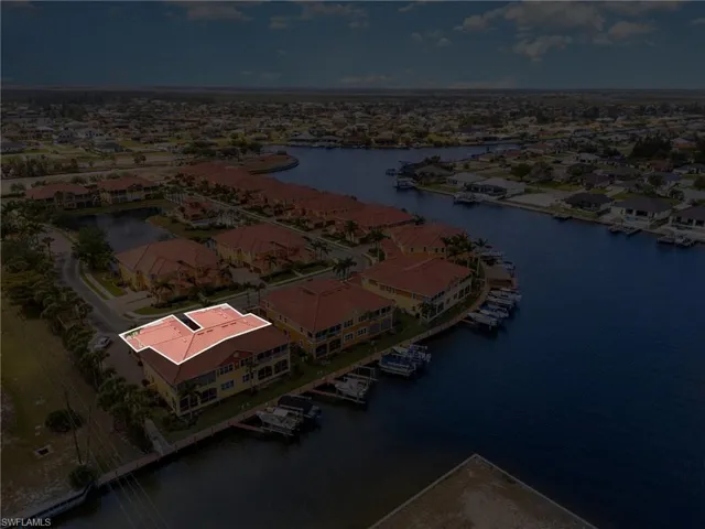 Drone / aerial view with a residential view and a water view