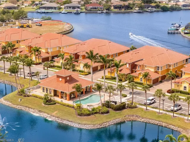 Drone / aerial view featuring a water view and a residential view