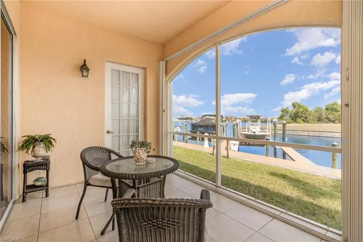Sunroom / solarium with a water view