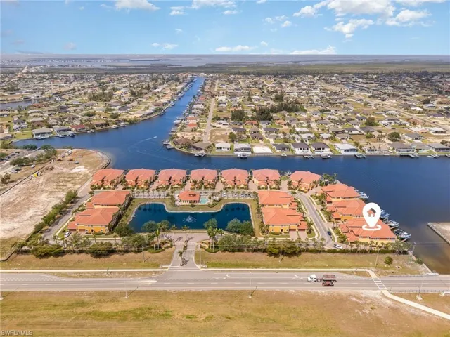 Drone / aerial view featuring a water view and a residential view