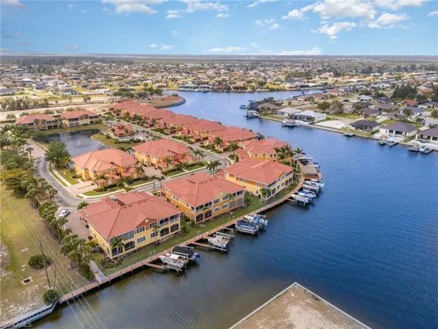 Birds eye view of property featuring a residential view and a water view