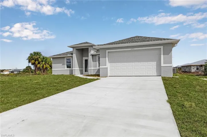 View of front of property featuring a garage and a front lawn. Finishes may vary, pictures for illustration purposes only