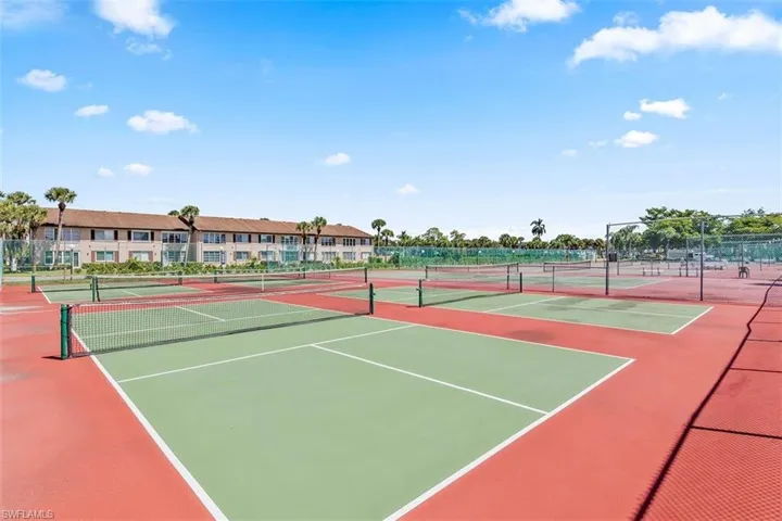 View of tennis court featuring community basketball court