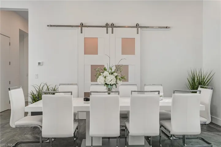 Dining space featuring a barn door