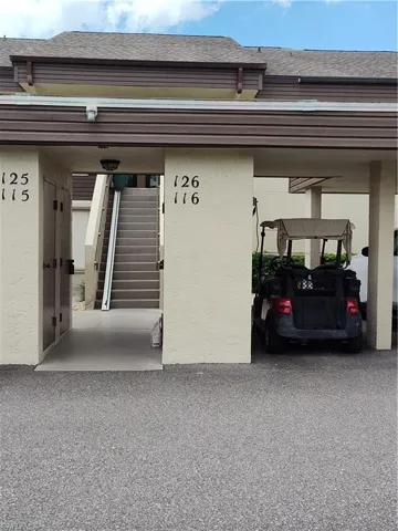 Garage featuring a carport