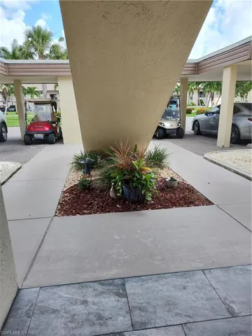 View of home's exterior featuring a carport