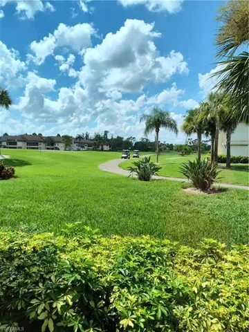 View of home's community featuring a lawn