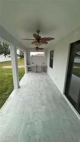 View of patio / terrace featuring ceiling fan and exterior kitchen