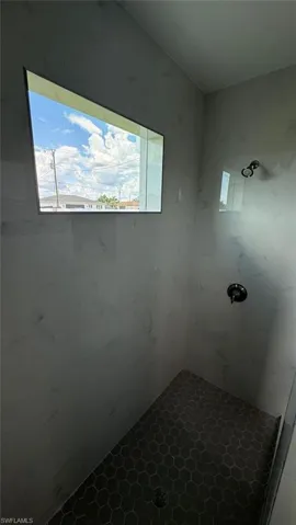 Full bathroom with tiled shower
