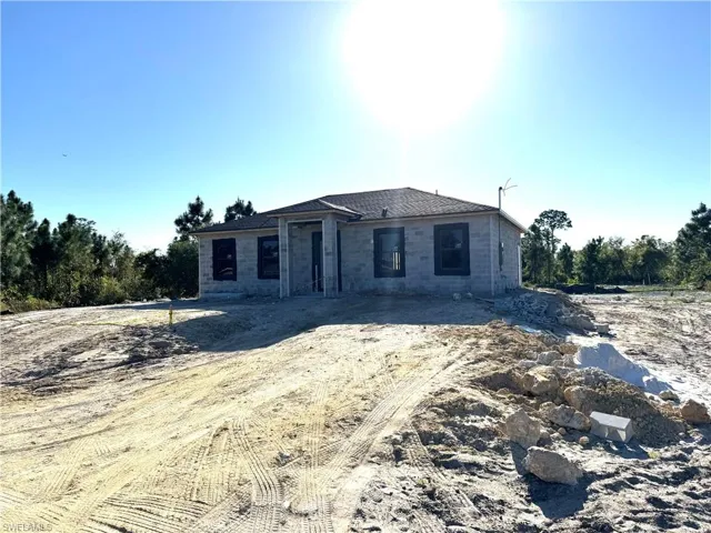 Unfinished property with concrete block siding