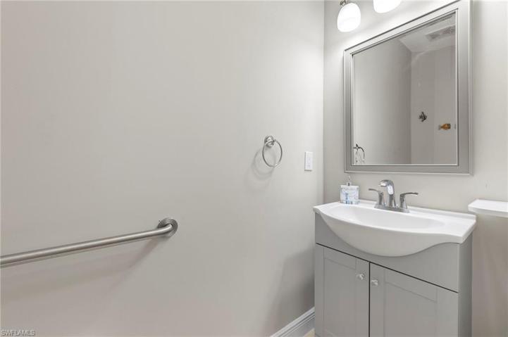 Guest half bath located downstairs