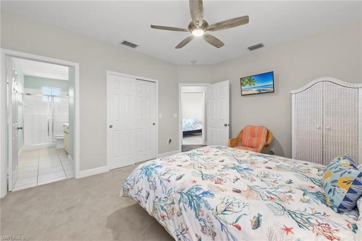 Guest bed has a walk-in closet and its own bathroom area.