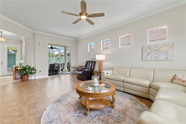 Huge Living room features transom windows for tons of natural light.