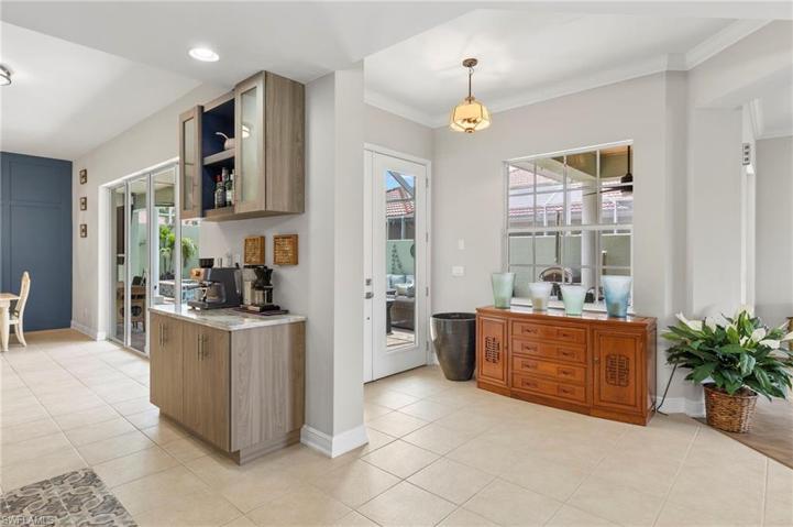 Glass front Door entry brings more natural light to this home.
