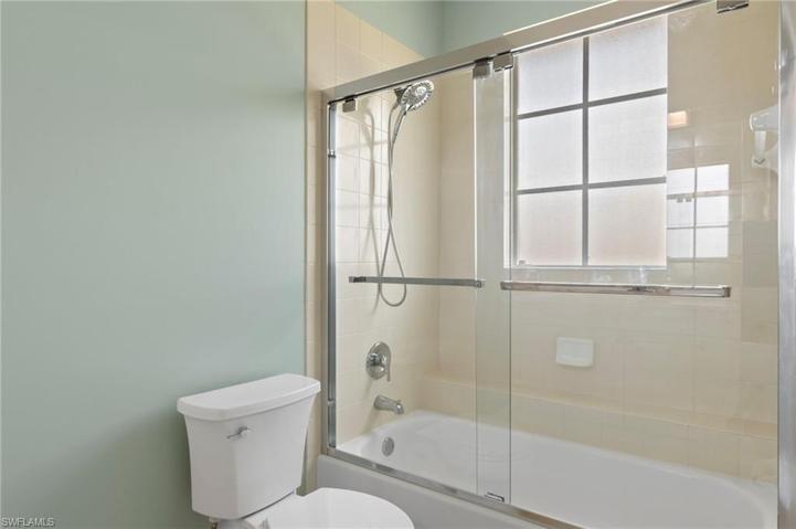 Guest Bed Bath with glass shower enclosure
