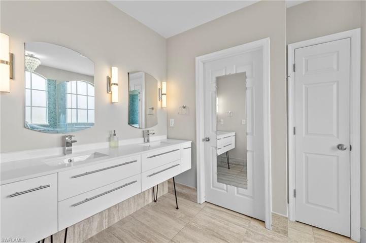 Updated Primary Bathroom with his and hers sinks.  Linen closet as well.