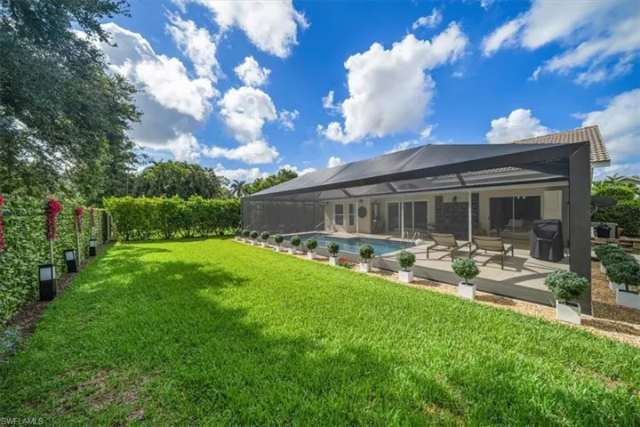View of yard with a fenced in pool and a patio