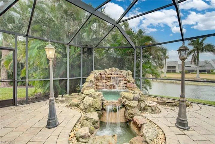 View of patio with a lanai
