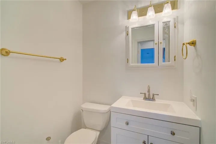 Bathroom featuring toilet and vanity