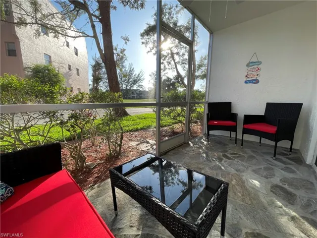 Sunroom featuring a patio