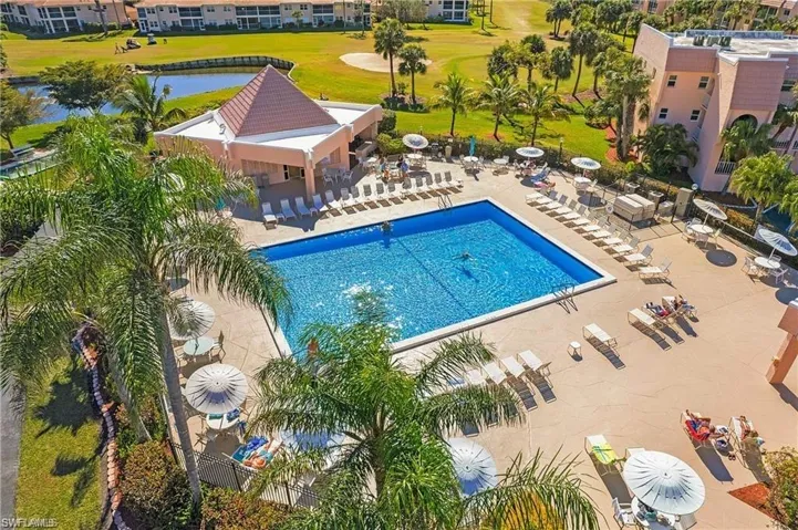 Community pool featuring a patio and a water view