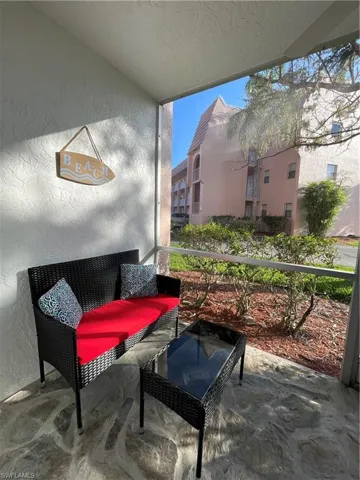 View of patio featuring a sunroom