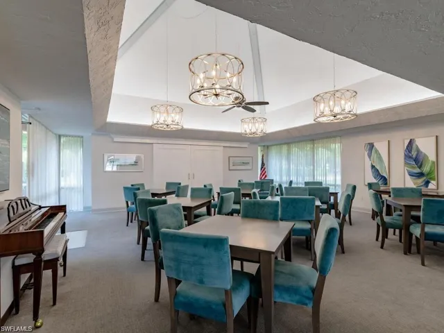 Dining space featuring light carpet