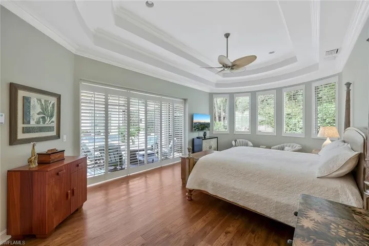 Primary Suite w. Sliders to Lanai & Curved Wall of Windows