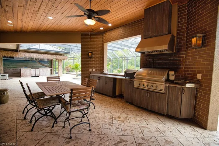 View of patio / terrace with area for grilling, sink, an outdoor kitchen, and ceiling fan