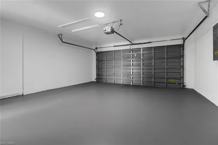 Garage featuring a garage door opener