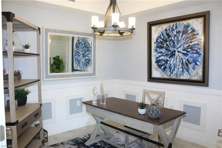 Office area with a chandelier