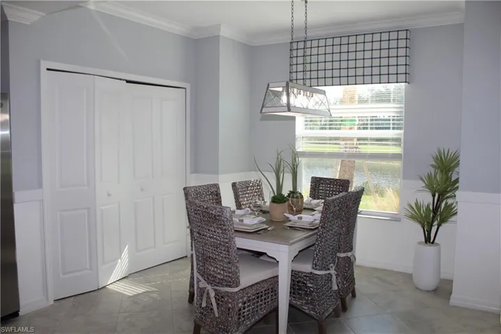 Dining room featuring crown molding and a desk