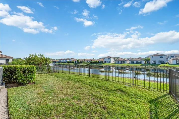 View of yard with a water view