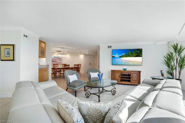 Tiled living room with crown molding