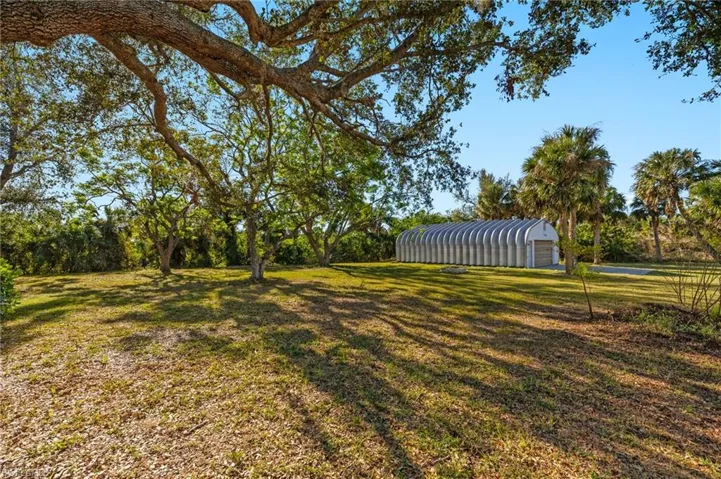 Quonset with rear entrance from the property