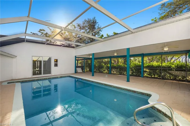 Pool with huge covered area and Hot tub tucked in the corner