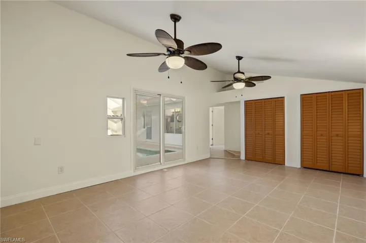 Primary bedroom with slider to the pool