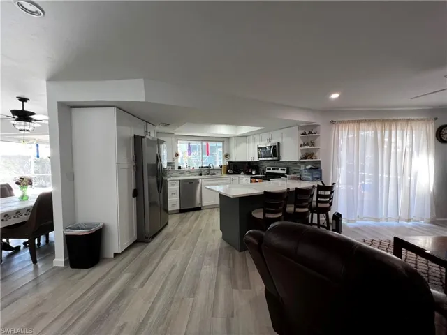 Kitchen with adjoining living / dining spaces #2