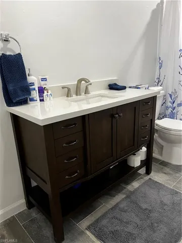 2nd Bathroom featuring vanity and toilet