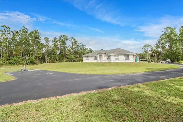 Single story home featuring a front yard