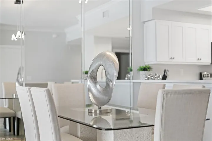 Dining space featuring ornamental molding