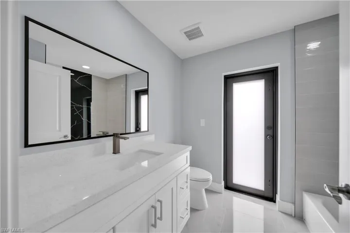 Bathroom featuring toilet and vanity