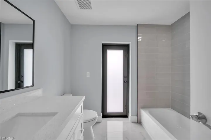 Bathroom with vanity and toilet