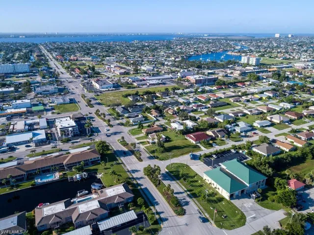 View of property location with a large body of water and nearby urban area