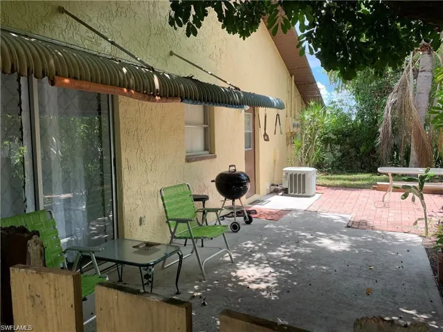 View of patio featuring a grill