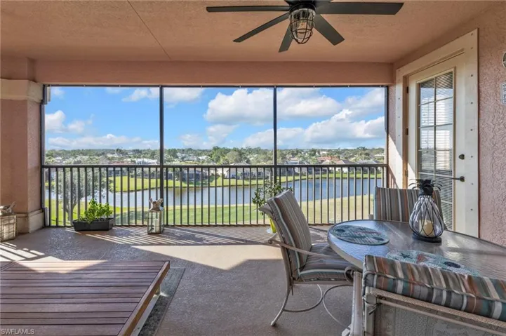 Sunroom / solarium with a water view