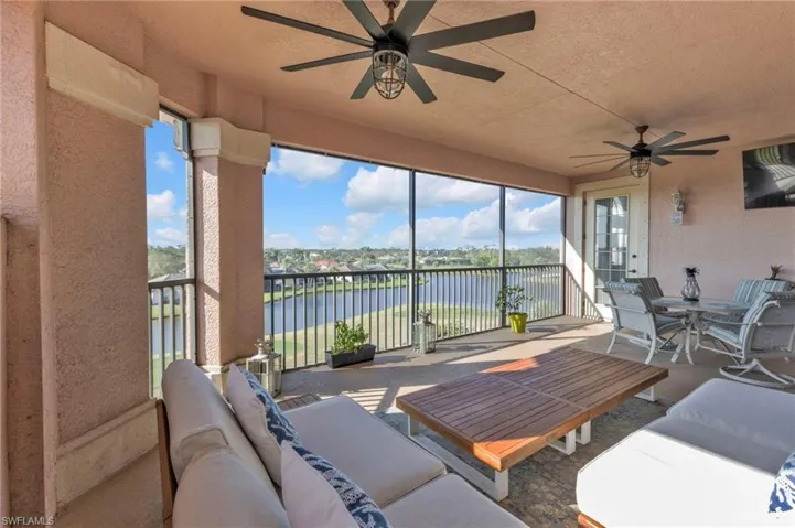 View of patio featuring outdoor lounge area, a balcony, and a ceiling fan