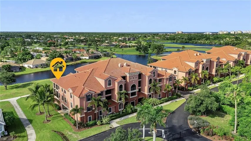 Aerial view featuring a water view and a residential view