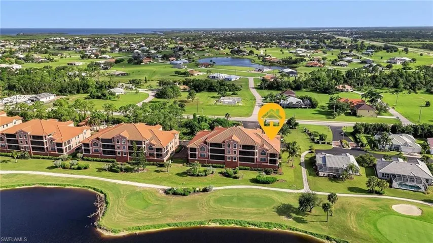 Aerial view featuring a residential view, a water view, and golf course view